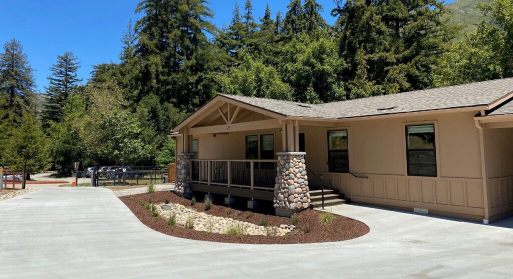 Chp Government Housing In Big Sur, Ca. Modular Construction With Garage, Carports, And Paved Driveway. Nestled In The Forest.