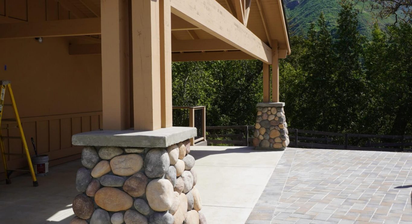 CHP government housing in Big Sur, CA. Modular construction with garage, carports, and paved driveway. Nestled in the forest.