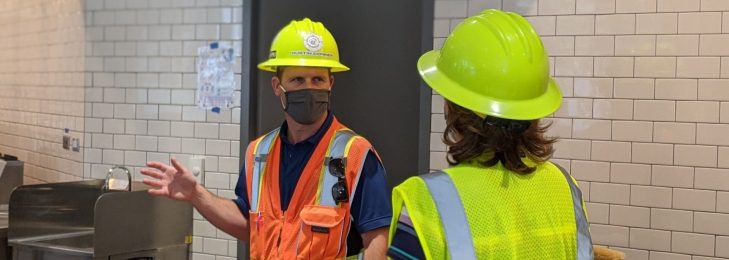 Construction developers on the jobsite, discussing their plan for an upcoming build.